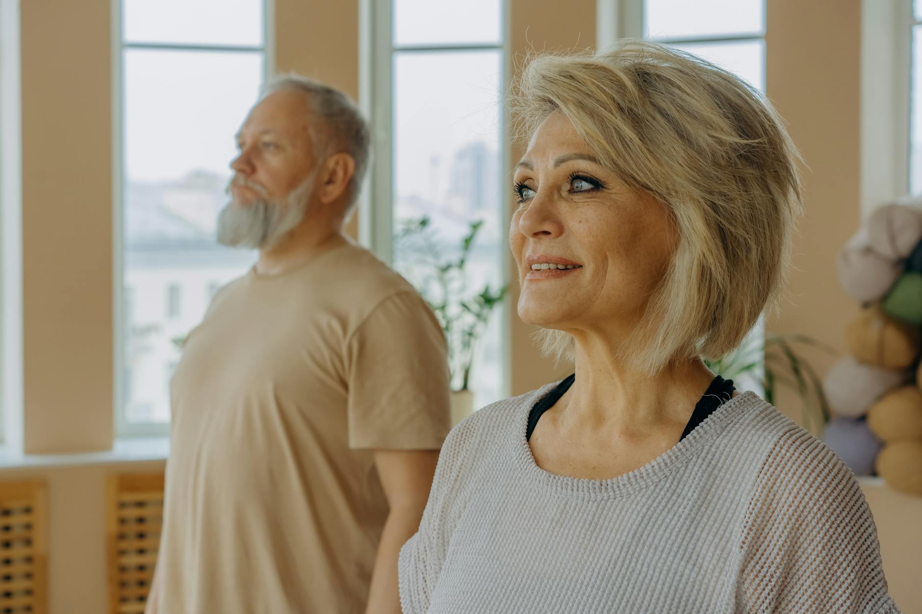 Group of people of different ages in a calm yoga class